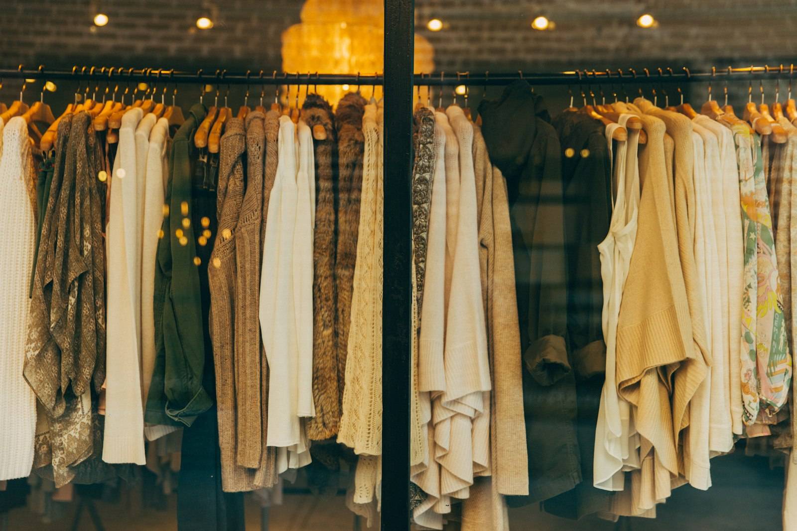 Clothing rack seen through a shop window